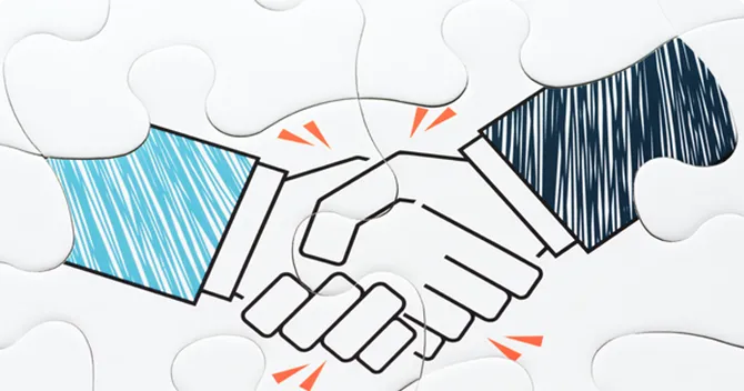 組み合わせ自由なパズルと握手しているイメージ画像